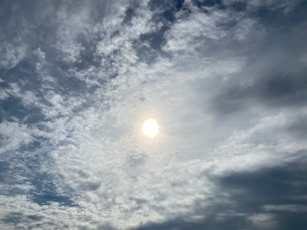 Dark storm clouds gather over Mount Osorezan—an ominous sky reflecting Japan’s Buddhist land of the dead.