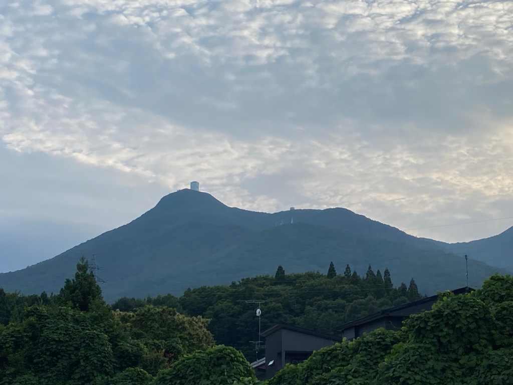 Sacred Mount Osorezan seen from the base, shrouded in cloud and myth, believed to be a path to the underworld.