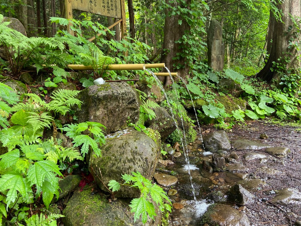 Lush spring of Osorezan Reisui, legendary fountain said to make visitors ten years younger with a single sip.