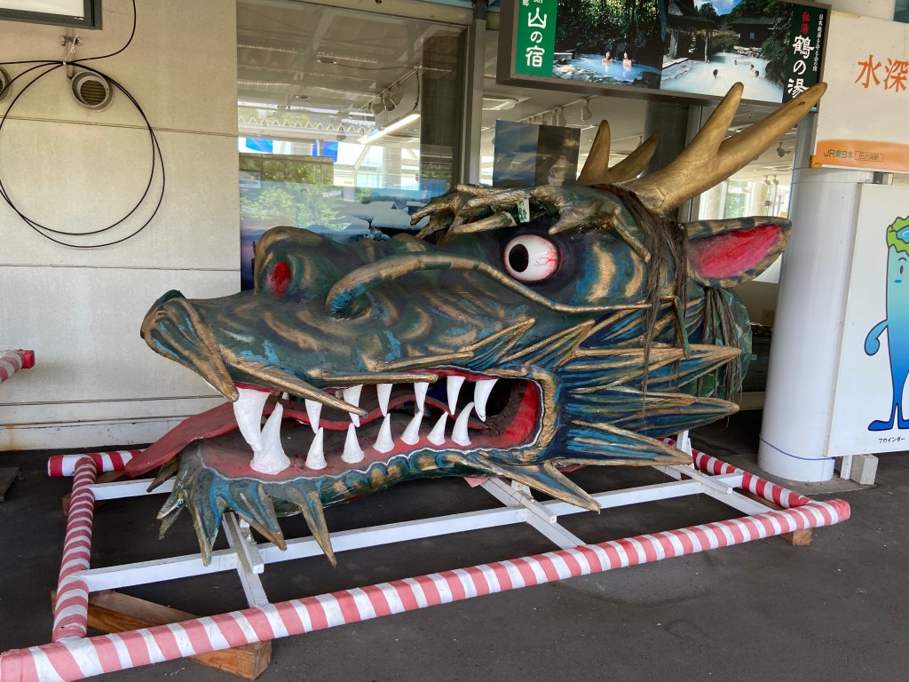 Vibrant festival-style dragon float on display at Tazawako Station, echoing the local legend of Tatsuko’s transformation.